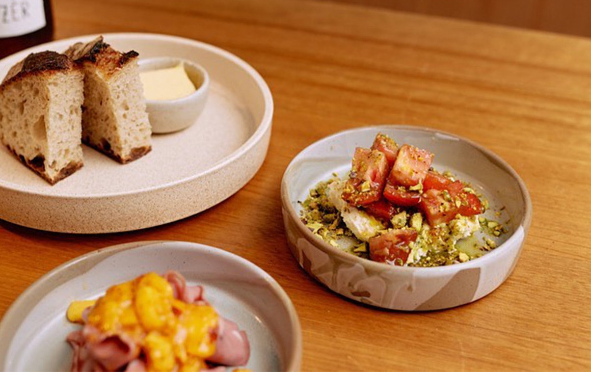 three plates of snack dishes on a table